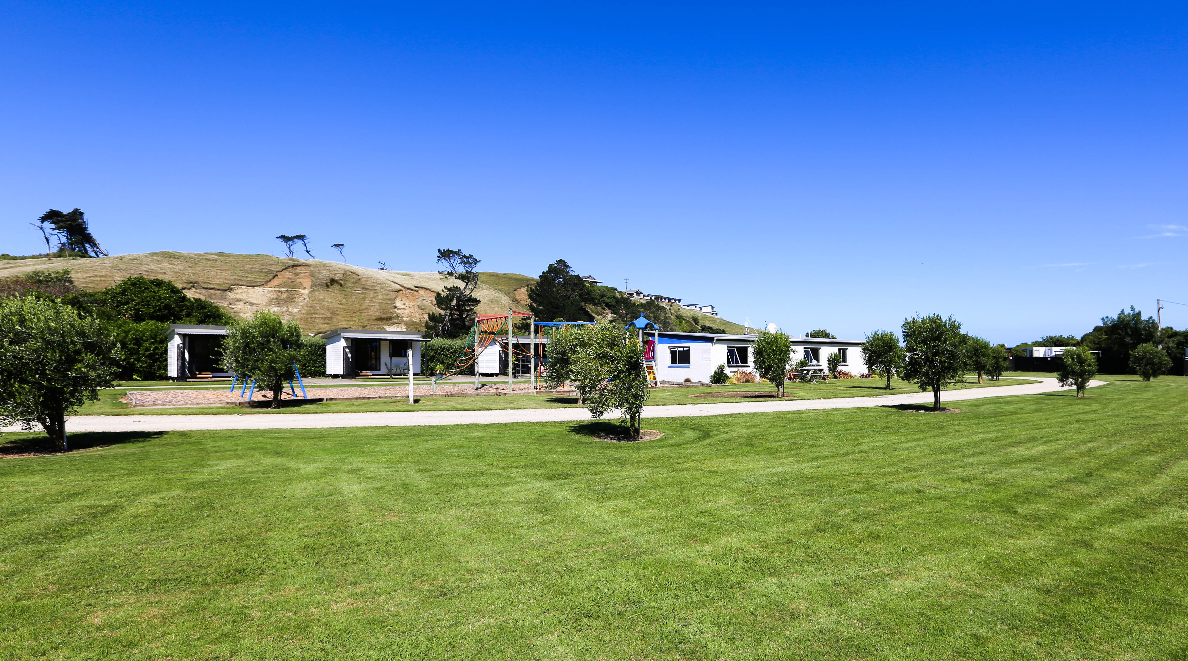 Park-like grounds at Kai Iwi Beach Holiday Park